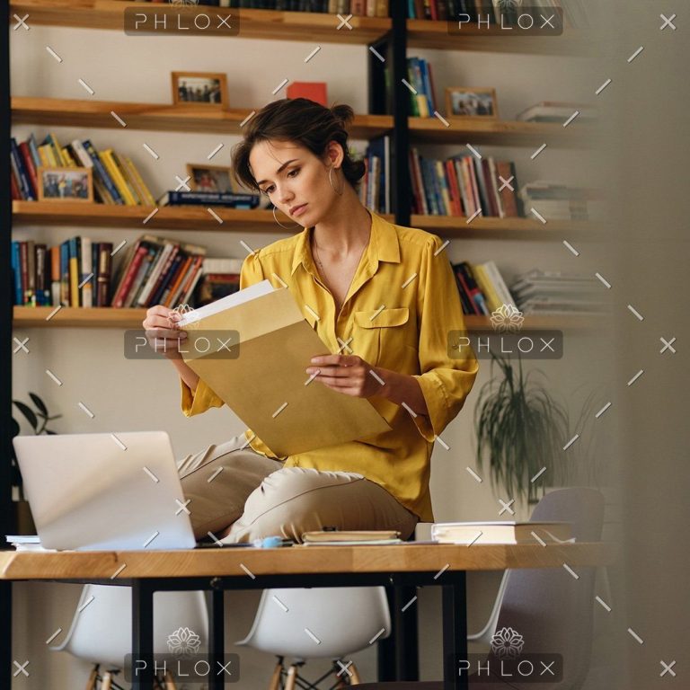 demo-attachment-468-beautiful-woman-in-shirt-sitting-on-desk-with-LE96BAG