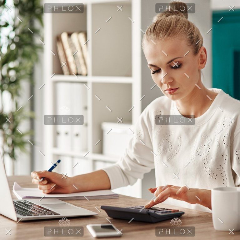 demo-attachment-469-concentrated-woman-budgeting-at-office-RVS7TEP