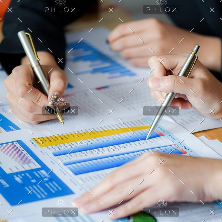 demo-attachment-489-female-office-staff-are-summarizing-the-number-in-6NXGYBK