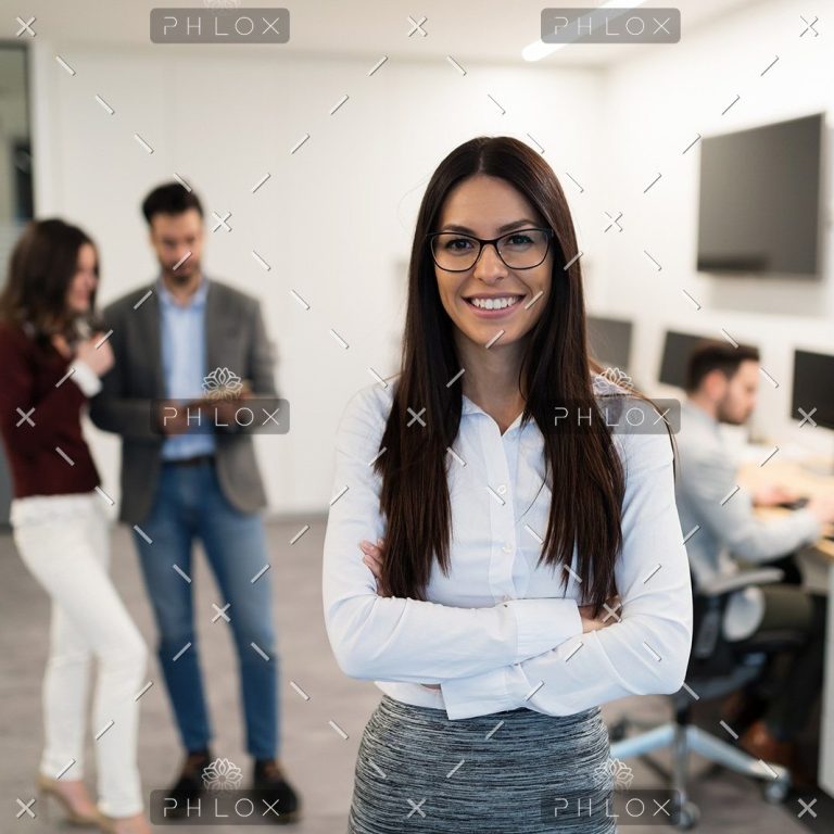 demo-attachment-472-portrait-of-young-businesswoman-posing-in-office-WEU5FBG